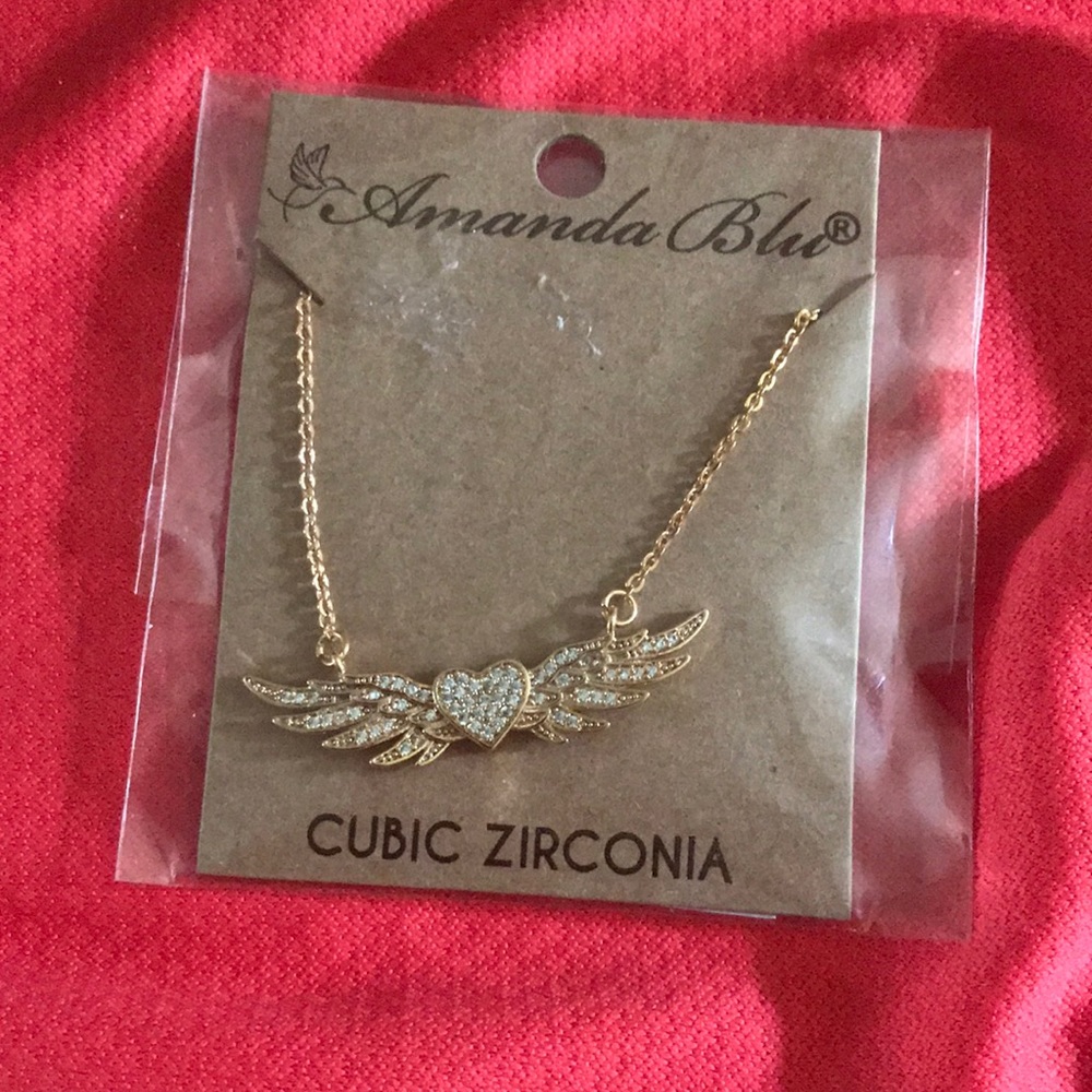 Gold heart with wings necklace from Amanda blu.